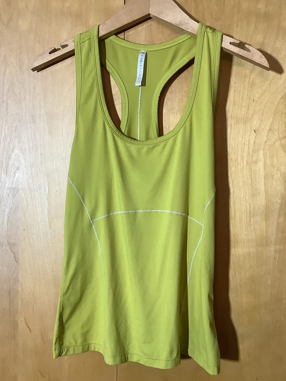 Fabletics mustard racer back tank, size medium